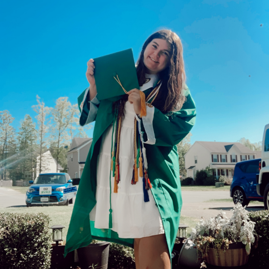 Senior+Hailey+Johnson+picks+up+her+cap+and+gown+on+Apr.+29%2C+2021.