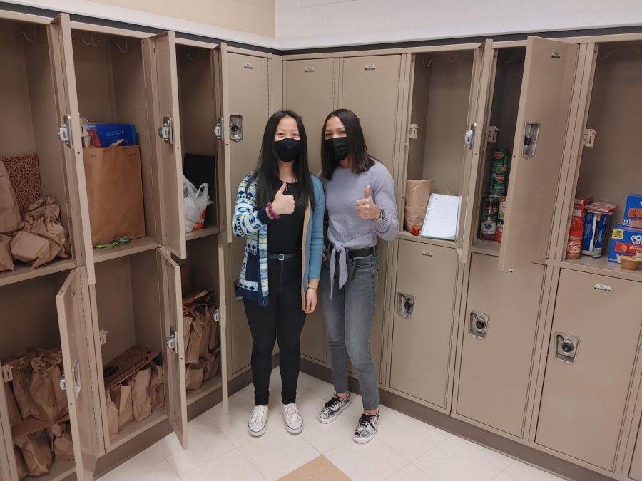 Sophomores Vi Chau and Jayla Adkins keeping the CHHS food pantry organized. 