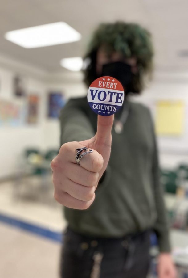 Seniors display their I Voted stickers as a badge of honor, representing civic and social engagement.  