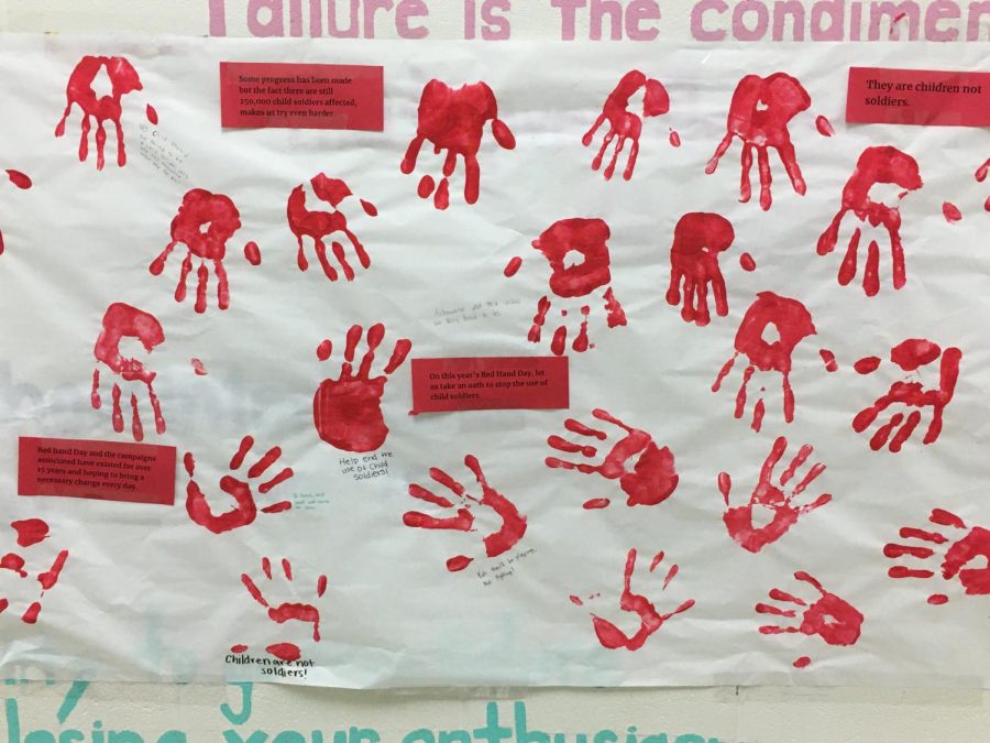 Red hands hanging outside of Klines English class.