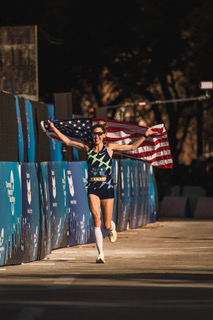 D’Amato parades with the American flag after her record-setting race.