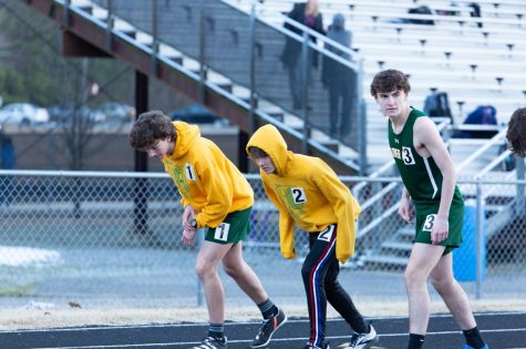 Andrew Bennett (11), Caleb Wilcox (10) and Dom Campo (11) line up to begin the 1,000-meter run at James River High School on Feb. 1.