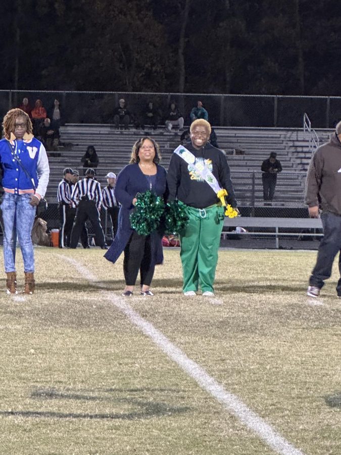 Bryce Hicks stands on the 50-yard line as he is recognized on Senior Night 2022.