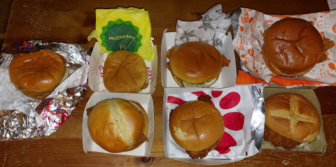 A collection of chicken sandwiches from the different fast food restaurants.