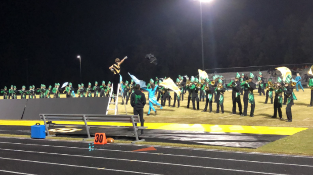 The Marching Cavaliers perform at halftime of the football game against Monacan High School on Oct. 28. Following the show, the band held their senior night ceremony.