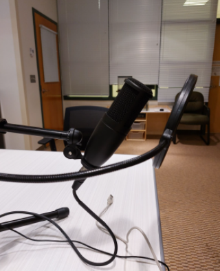 A microphone in the podcast room, the Hive on the Hill, above the library