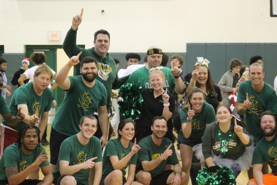 The faculty celebrates a 32-29 win over the seniors following the game.