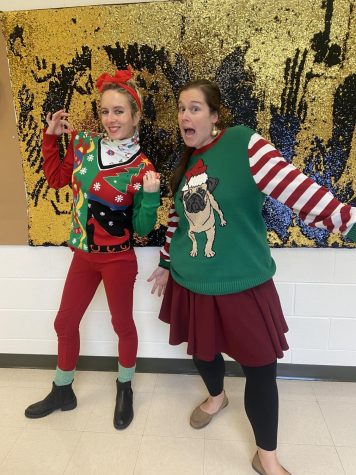 Art teachers Jamie Barnett (left) and Amanda Berneche (right) wear their tackiest and most festive sweaters for Deck the Halls day.