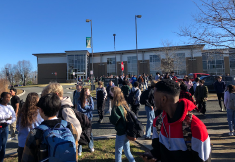 Students exit the building following a fire alarm on Thursday, Jan. 26. 