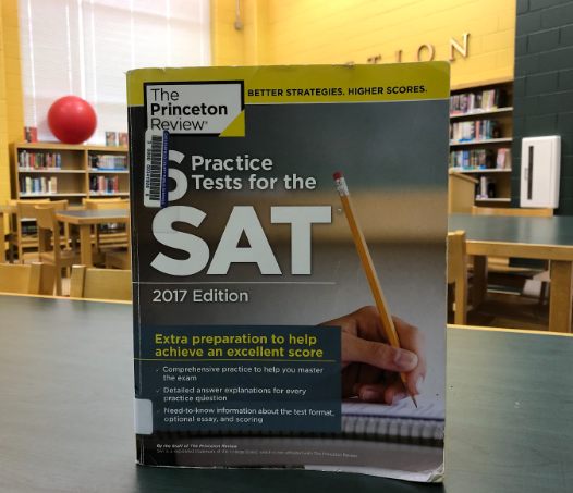 An SAT study book in the library, which students can use to prepare for the test.