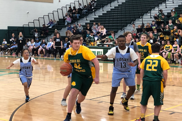 Sean Thomas dribbles the ball towards Cosbys basket.