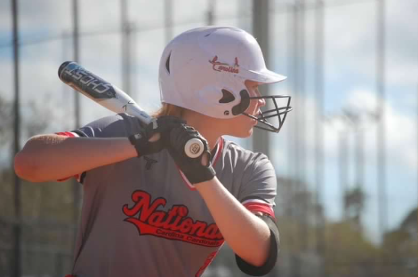 Thompson prepares to swing during an at-bat for her travel team.