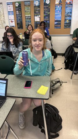 Junior Kady Harth holds an Ultraviolet-flavored Monster Energy drink.