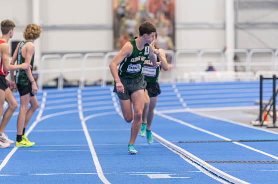Bennett receives a handoff from junior Andrew Ellingson during a 4 by 800 meter race earlier in the season.