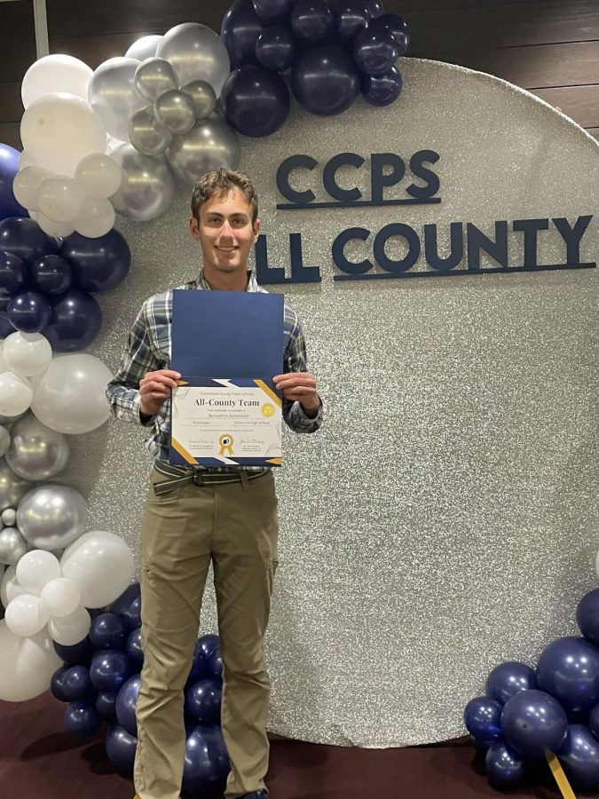Schneider with his award for journalism at the all-county team award ceremony