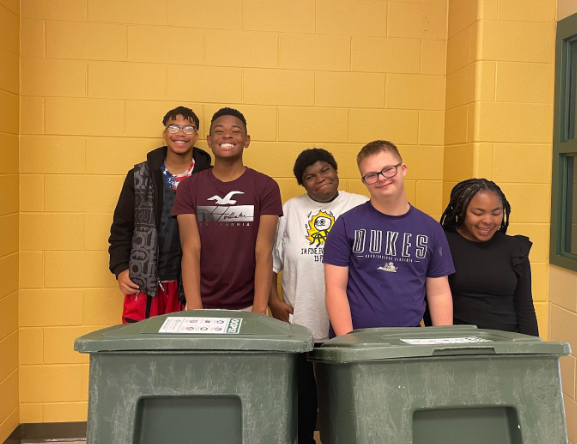 Students Jeremiah Johnson, Sirvion Evans, Chey Williams, Aiden Brown and Karliya Collins collect various recyclables in the 300 pod. 