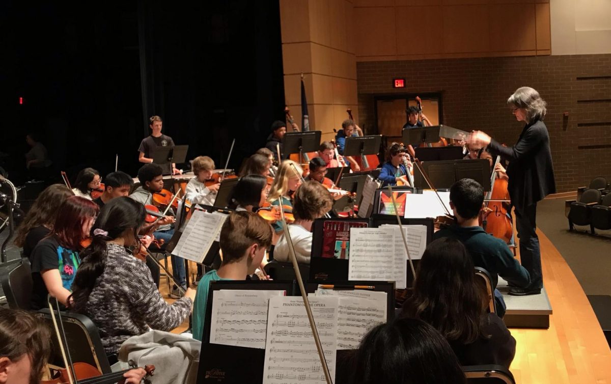 Maclin leads the combined orchestras through their Boo-roque concert rehearsal.