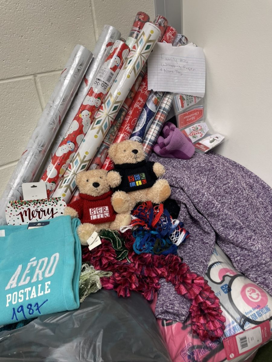 Toys donated to the Angel Tree leaning against a wall.