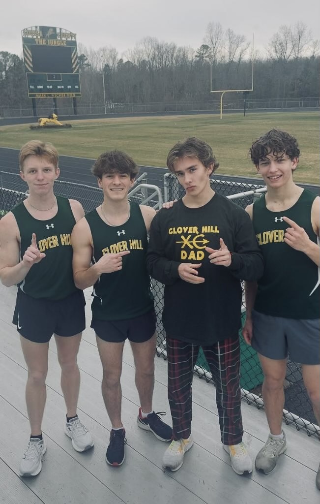 Caleb Wilcox posing with the 4x800 team. (From Left) Andrew Hathaway, Andrew Ellingson, Caleb Wilcox, Josh Taylor