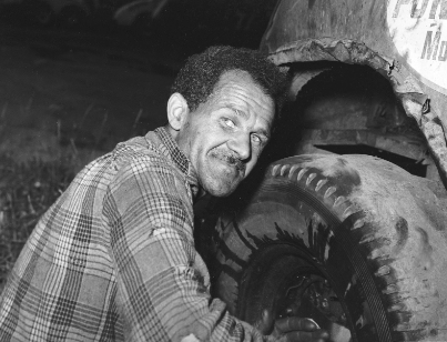 Wendell Scott fixing one of his race cars.