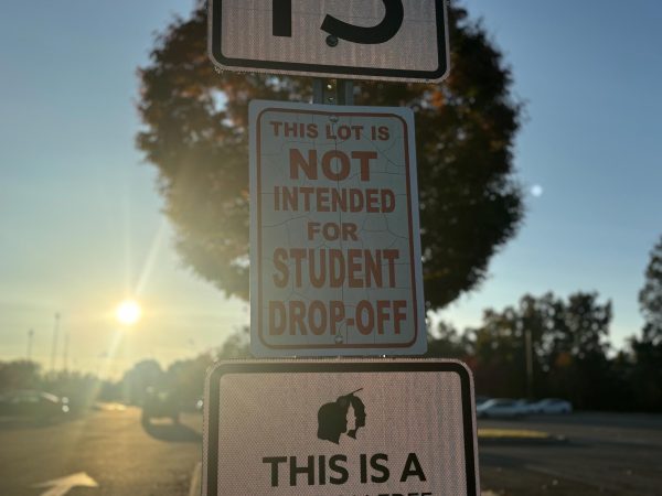 Sign in the student parking lot that clearly states it is not intended for student drop-off.