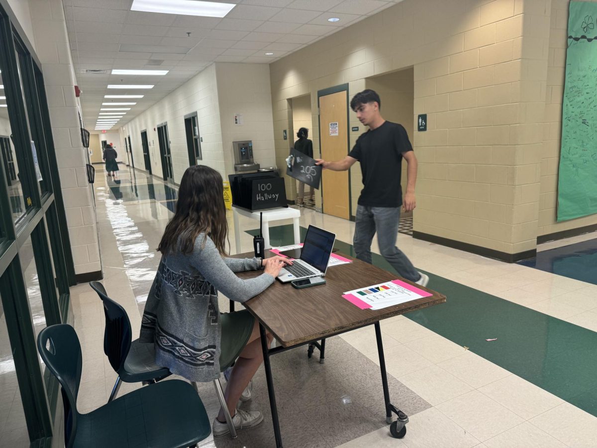 Teacher monitoring hallway activity