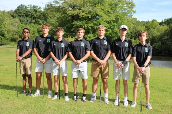 Senior golfers pose for a picture