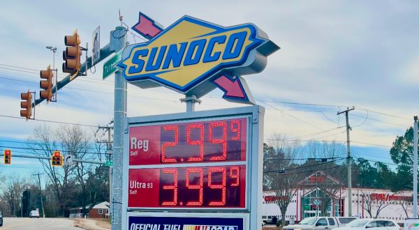 Sign in front of a Sunoco displaying the cost of regular and diesel gasoline