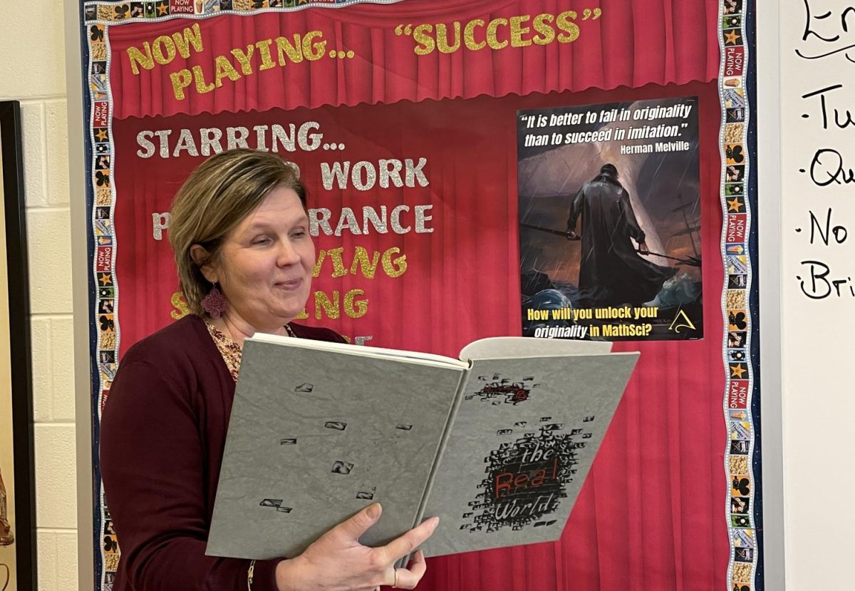 Kline holding Clover Hill's 1995 yearbook