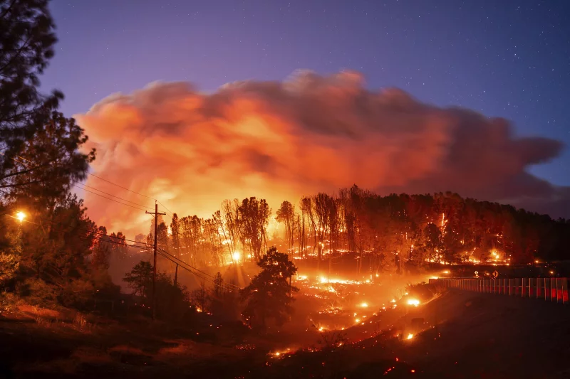 Photo of a wildfire courtesy of Noah Berger from the Associated Press