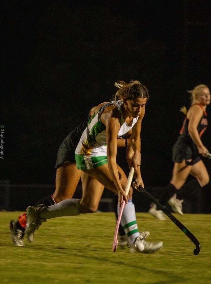 Varn-Holmes dribbling the ball down the field during a field hockey game against Powhatan. 