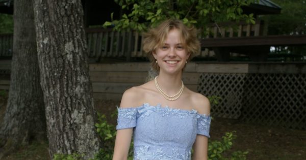 Purvis poses for a full body shot for their Senior Prom
