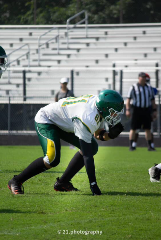 Number 61 on the line of scrimmage before the ball was snapped