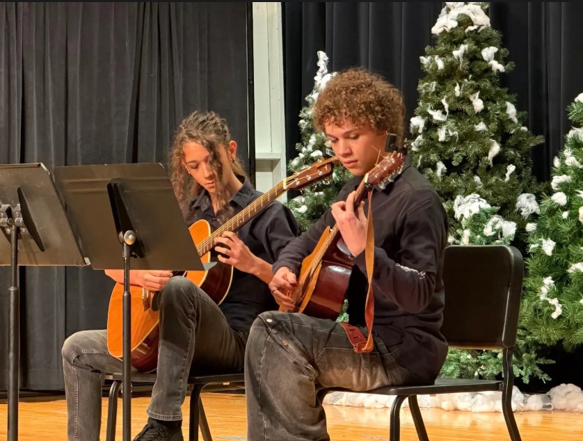 Juniors Harper Hincapie and Tyler Vaughn solo at the guitar concert. 