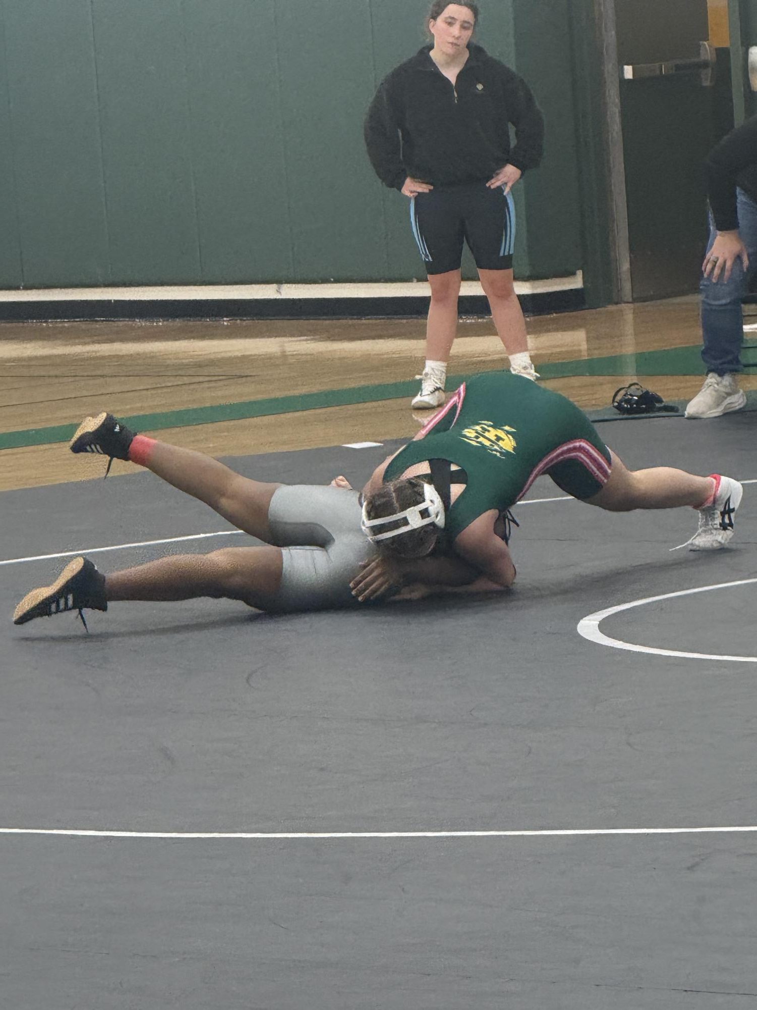 Two girls wrestling on the mat during the meet at Clover Hill