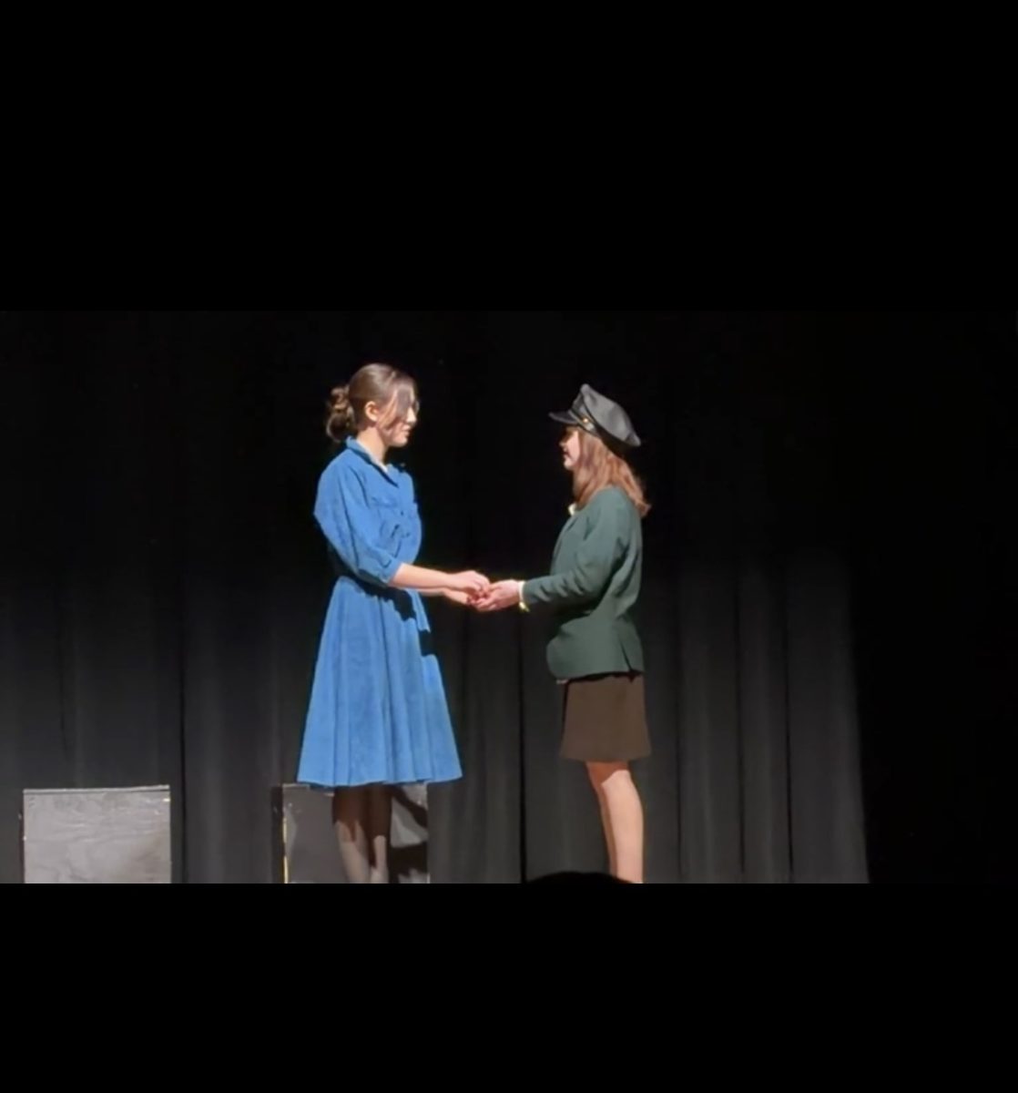 Lily Schofield and Julia Herald as Noor and Vera on stage at VHSL sectionals