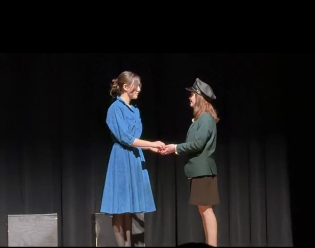 Lily Schofield and Julia Herald as Noor and Vera on stage at VHSL sectionals