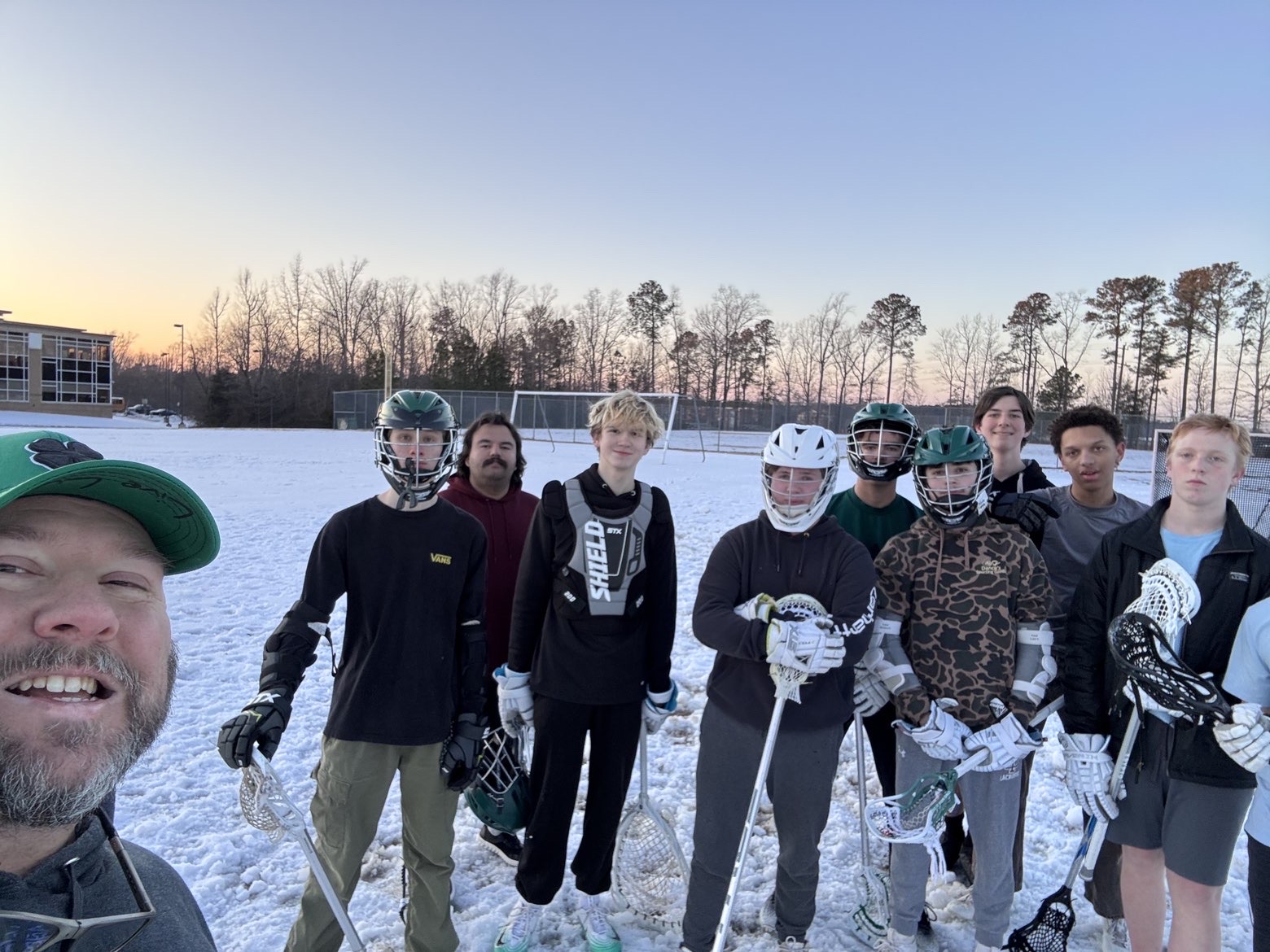 New coach, Brian Davis posing with the team