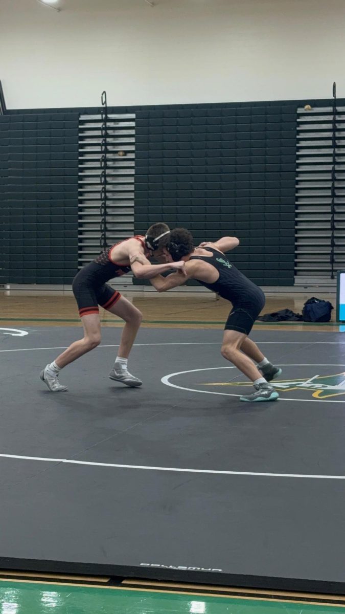 Preston Martin wrestling against Powhatan on Senior Night.