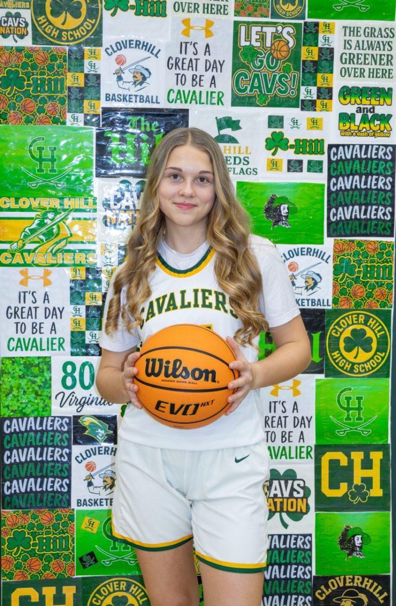 Abby Heath taking JV Women’s Basketball media day pictures.