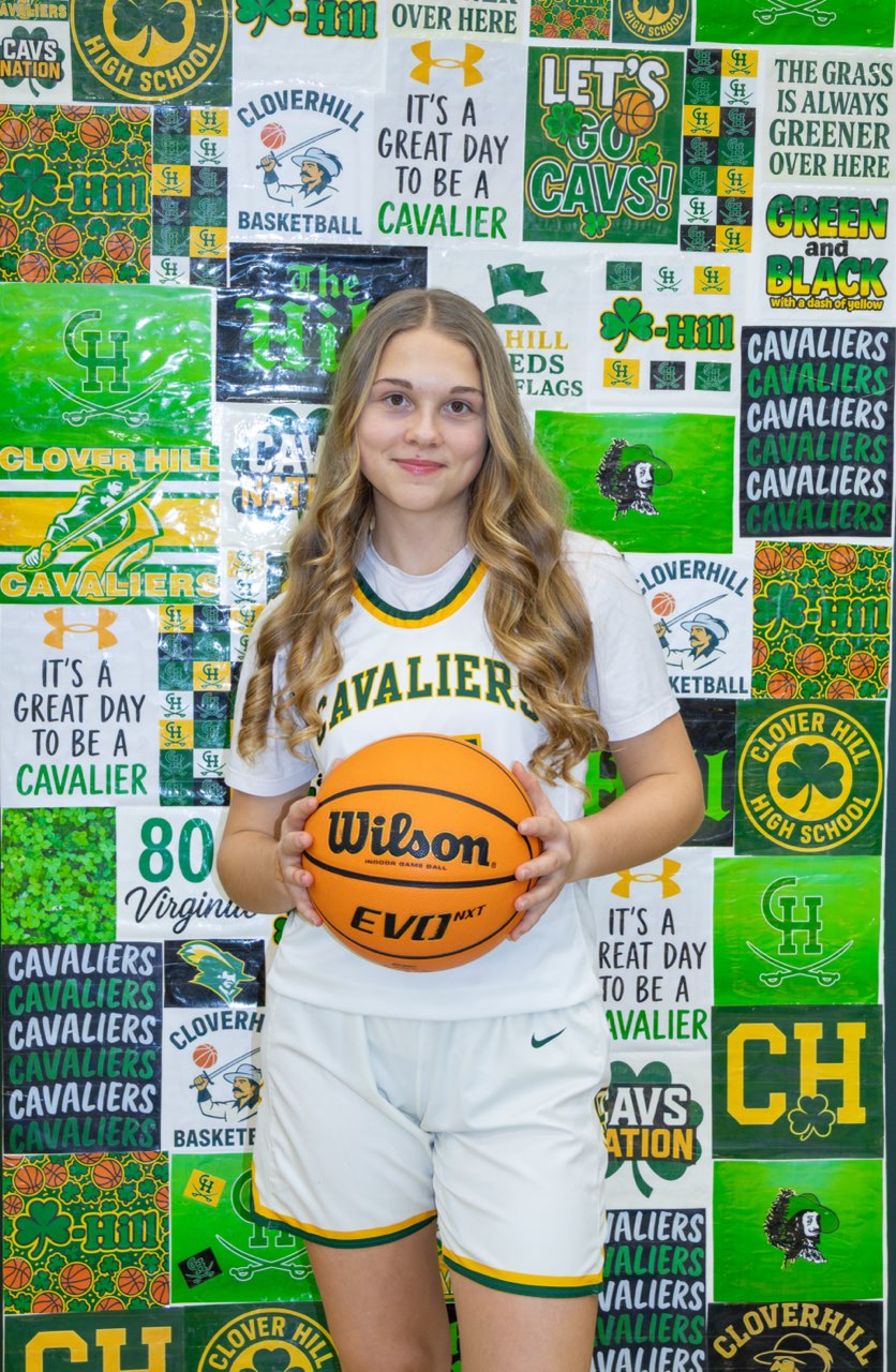 Abby Heath taking JV Women’s Basketball media day pictures.