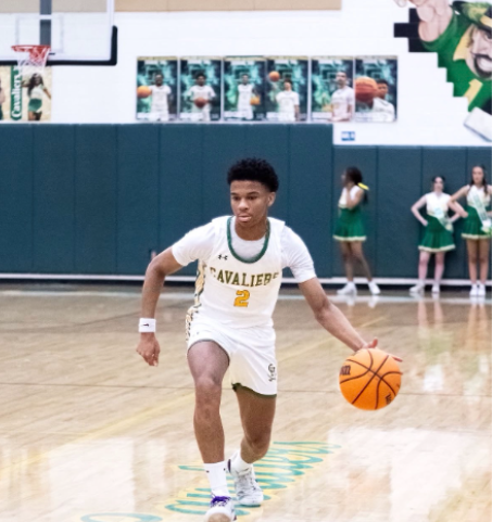 Senior Jeremiah Farmer takes the ball down the court.