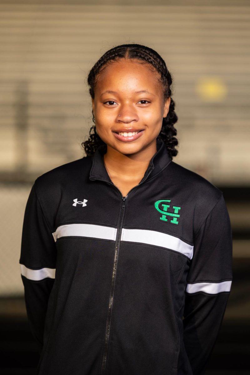 Kara Harris taking Track and Field media day pictures.
