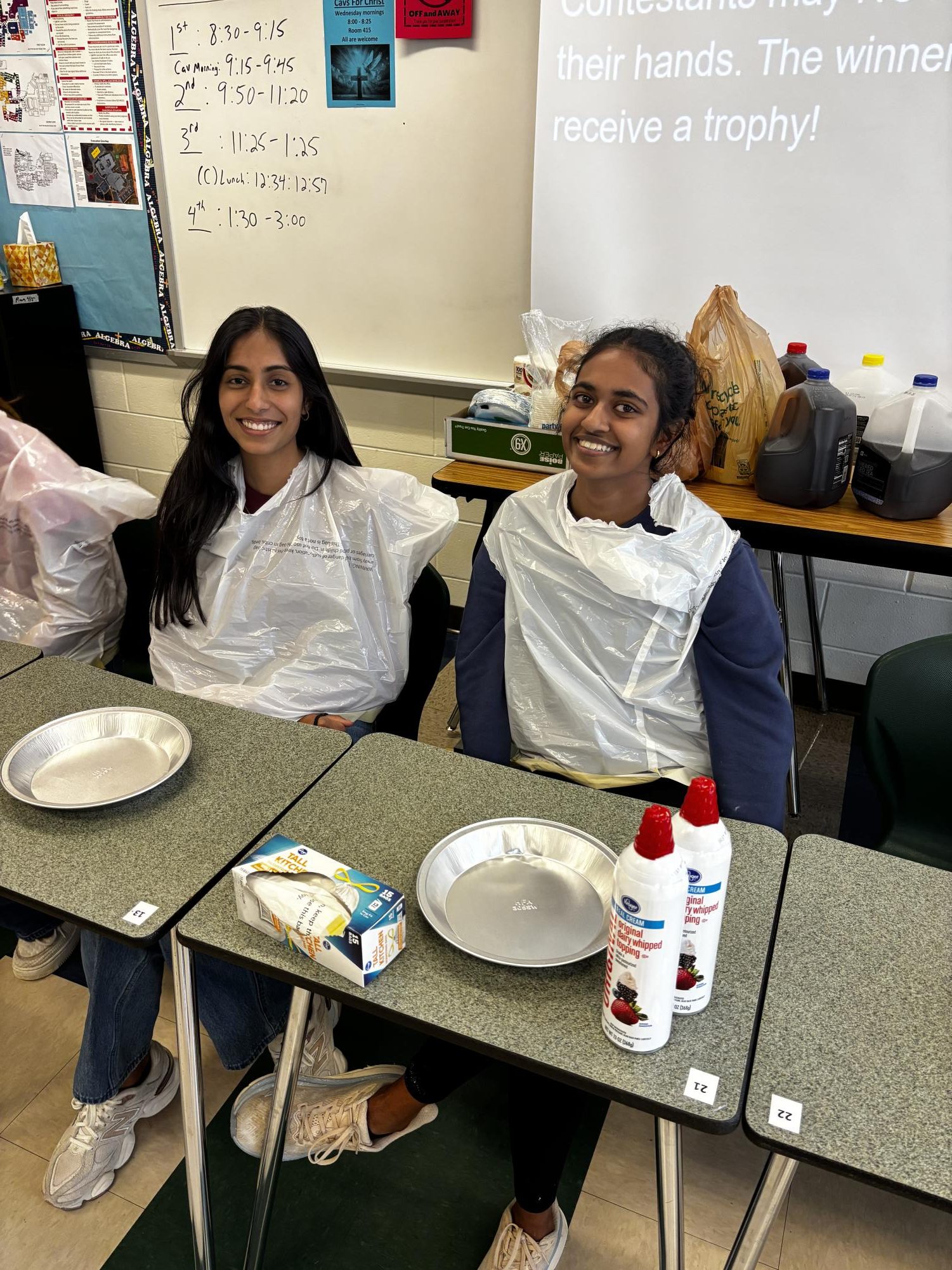 Two Mu Alpha Theta members posing before the pie eating competition. 