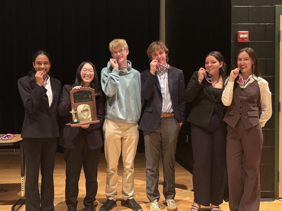 The Clover Hill Congress, Lincoln-Douglas, and public Forum competitors pose with their medals and the regional sweep-stake Trophy