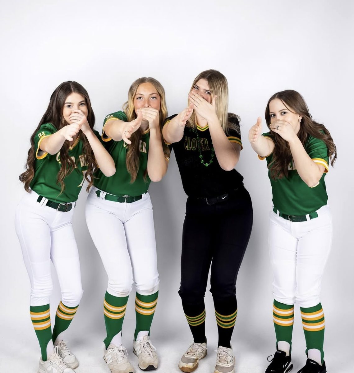 Varsity Softball is posing during media day.