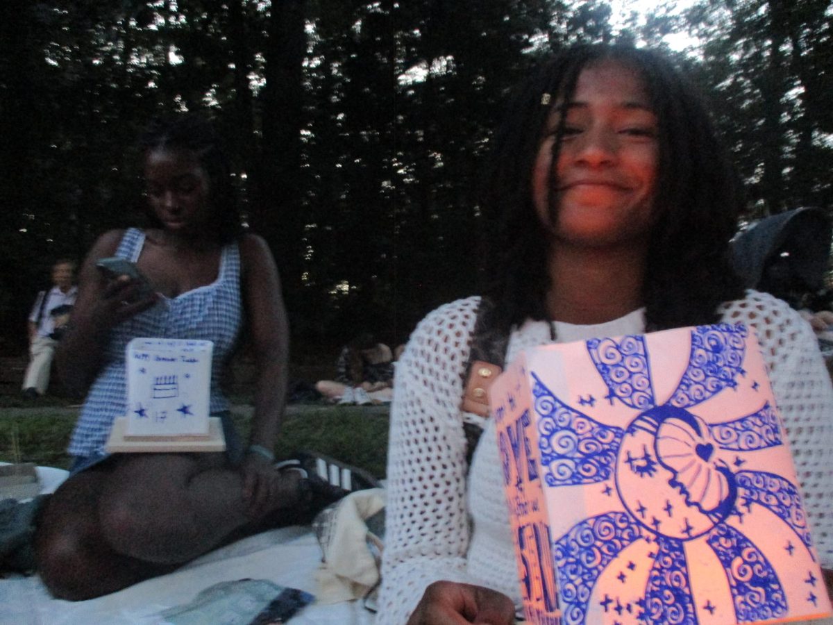 Abigail Frias holding a lantern she made