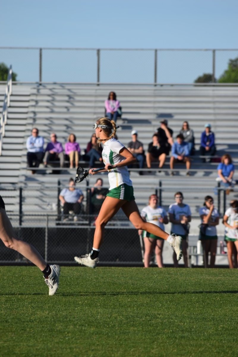 Gamache runs down the field during a game against Thomas Dale High School